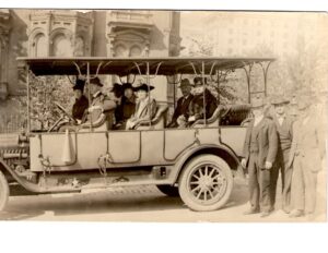 Touring cars like this were popular in the 1920's. Standing in the middle at the far right is John Meismer.

