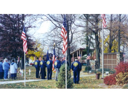 Veterans Day memorial in front of cobblestone entertainment stand