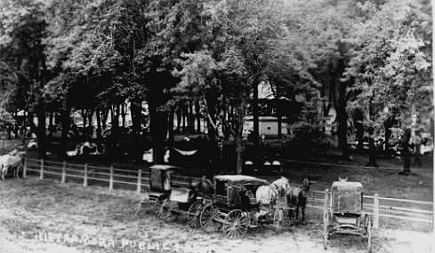 A fence surrounds the village square for horses to be tied up