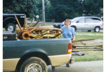 Blacksmith Laure brings home the donated wagon parts in June, 2005.