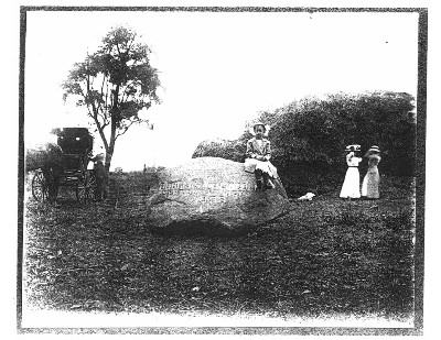 Mamie Bratt is the little girl sitting on the boulder.  Other ladies are not identified.