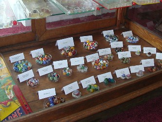 One display featured both hand made and machine made marbles as well as games manufactured by Marx, Wolverine and other toy makers.  