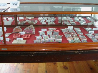 Another display featured marbles in the original packaging and various types of marble bags. 

