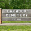 Sign at the entrance of Oakwood Cemetery.